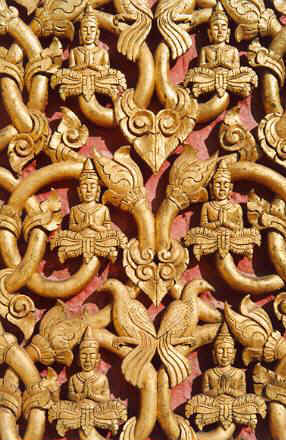 Almost every Lao temple has decorative wood carvings.