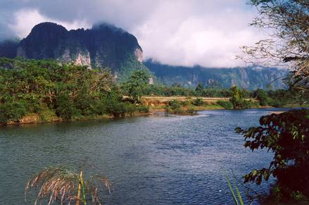 A nearby footbridge led across the Nam Song to caves in these limestone hills.