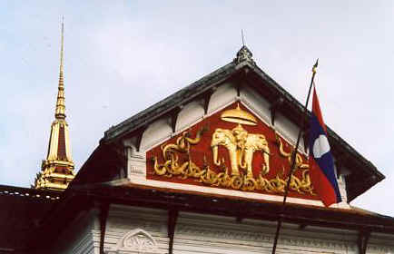 That's the Lao flag. The red bars symbolize courage and heroism, the blue is nationhood, and the white sphere is the "light of communism."