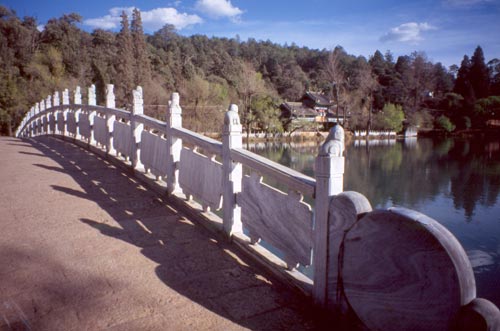 Little stone animals stand atop each railing post.