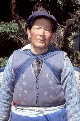 You'll likely be invited for tea by this Naxi woman in Baisha!