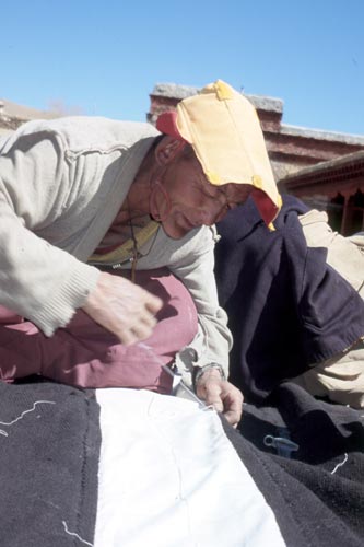 Sunblock lotion isn't available in this part of the world, so monks wear a nifty sunshade.